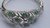 Bracelet manchette floral serti d'émeraudes et de topazes blanches naturelles. Total de 124,95 ct.